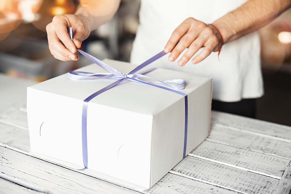 Beautifully wrapped subscription box with pies, cookies and other baked goods.
